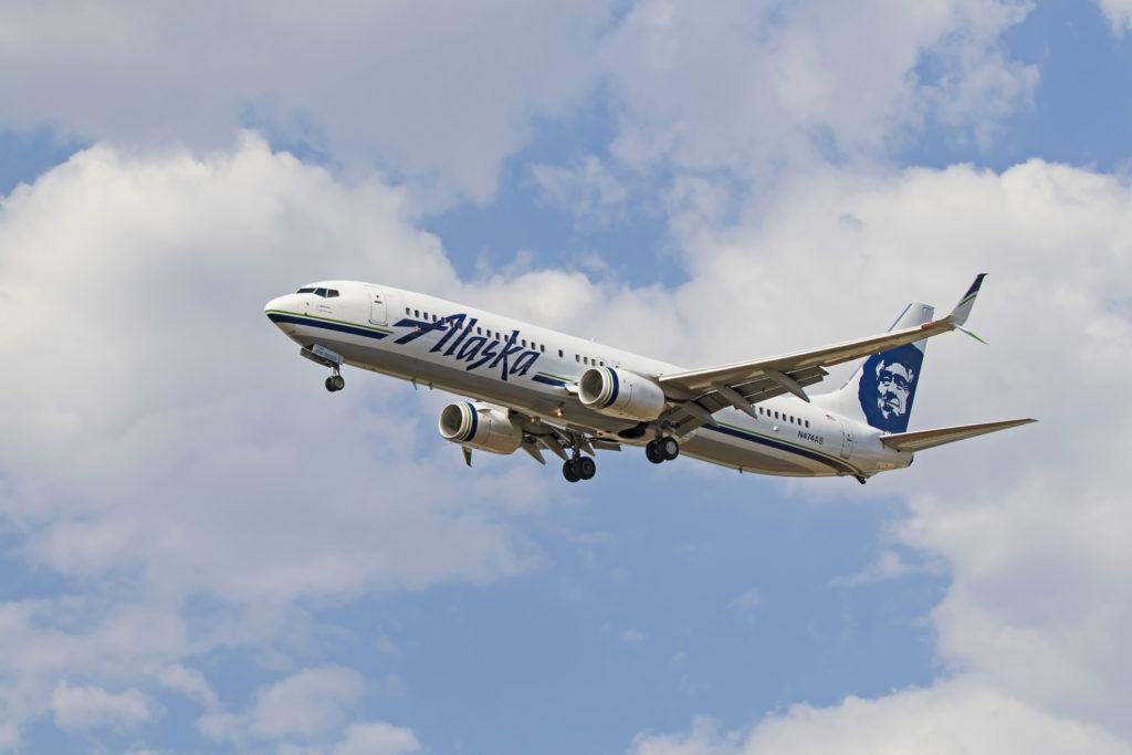  Alaska Airlines - book ticket using credit card to get free baggage fee