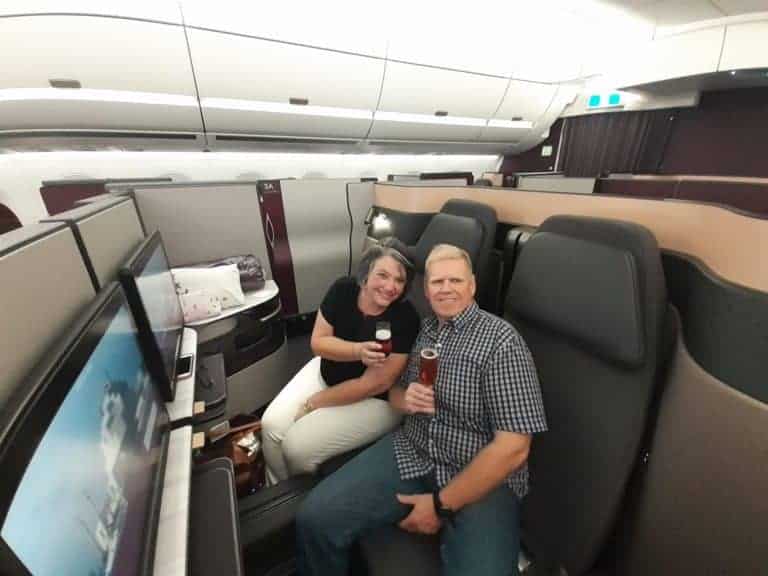 Enjoying a glass of champagne in Qatar Airways Qsuites.