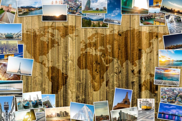 Travel photos on a wooden background