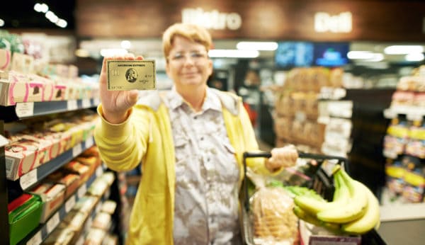 Portrait of a woman using the card at the supermarket