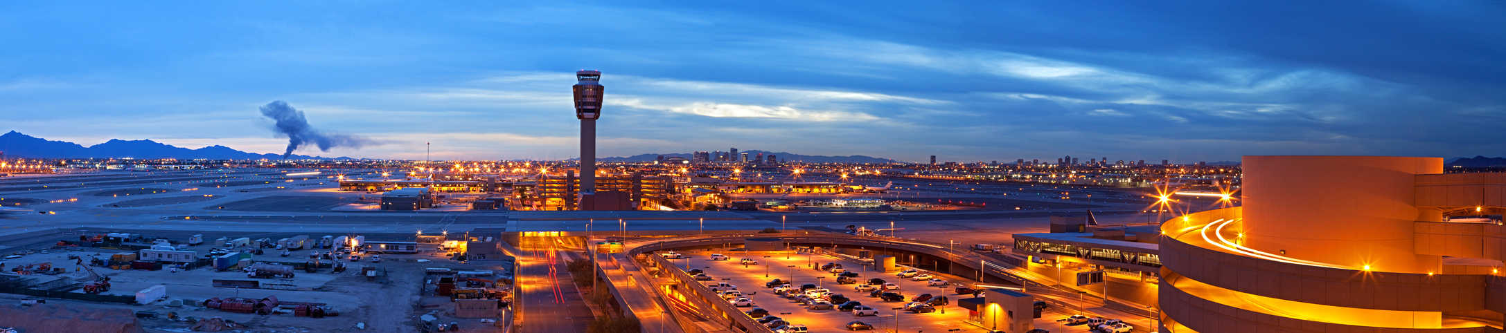 A panoramic view of an airport at dawn