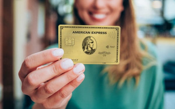 young woman holding a credit card