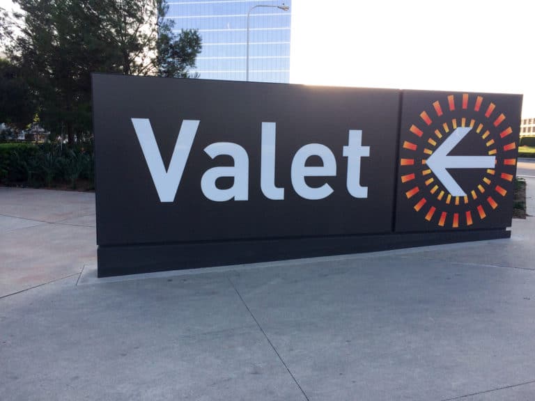 Valet parking sign big on ground entrance garage level outdoor