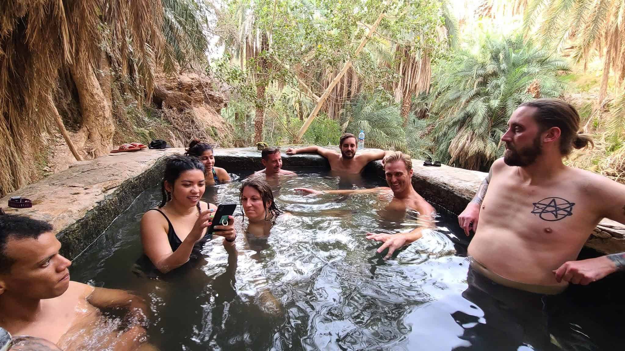 a refreshing dip in Terjit Oasis, Mauritania