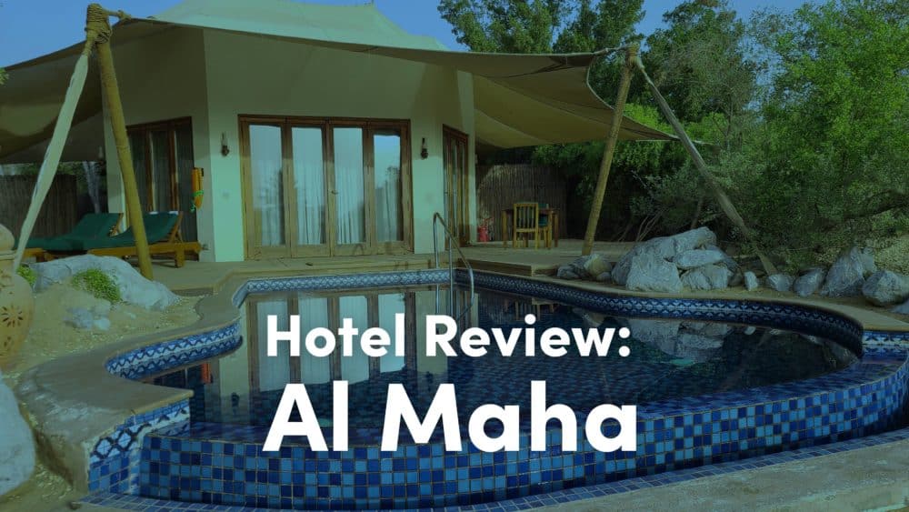 Al Haha Review - a picture of a hotel room in the desert with a pool out front and the text on top that says Hotel Review: Al Haha