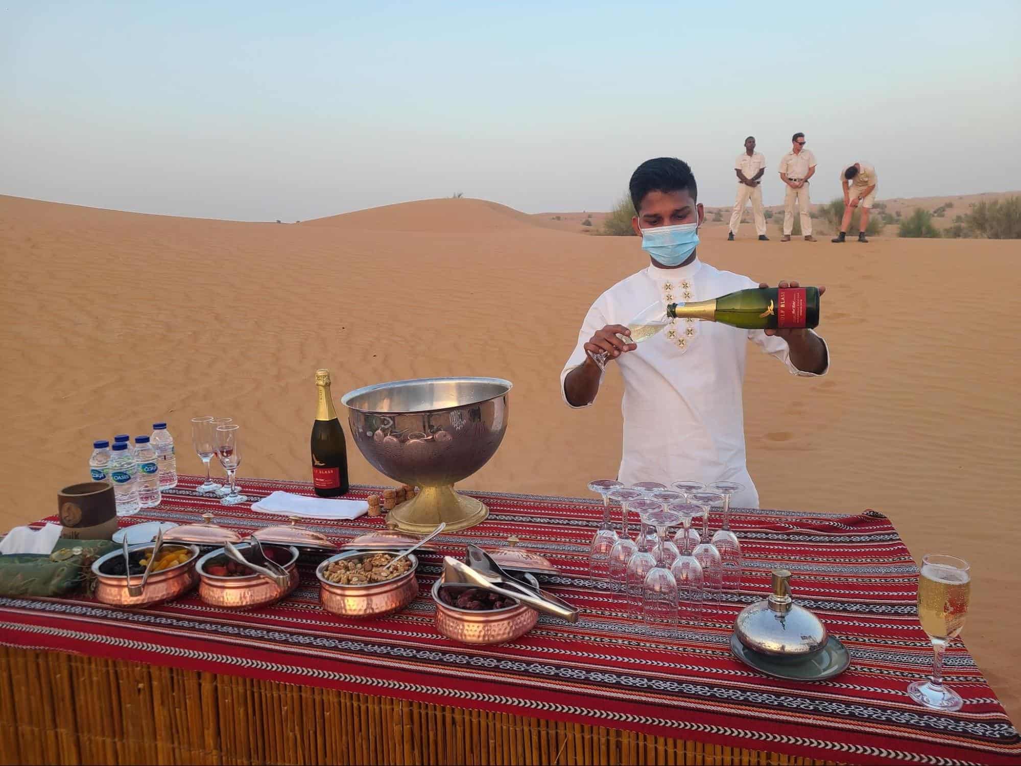 bartender serves drinks and snacks to the sunset chasers