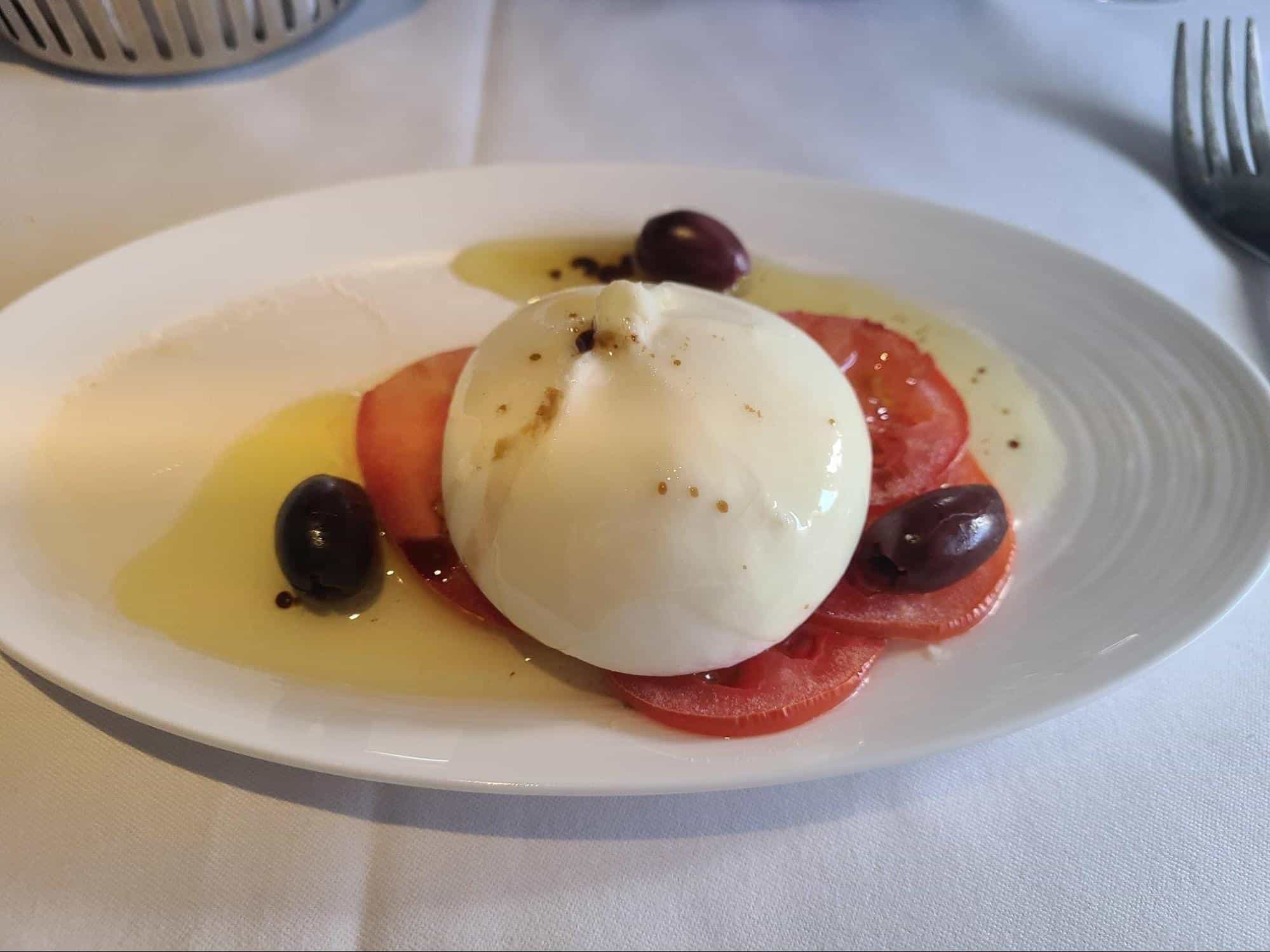 Burrata tomato carpaccio onboard Qatar Qsuites business class