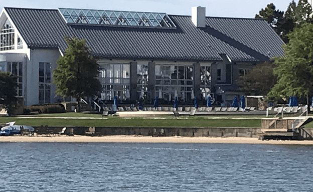 Small beach area in front of pools