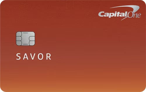 A Capital One Savor credit card with a copper-orange background offers points for travel. It features a chip on the left, the Capital One logo in the top right corner, and “SAVOR” in white text near the center.