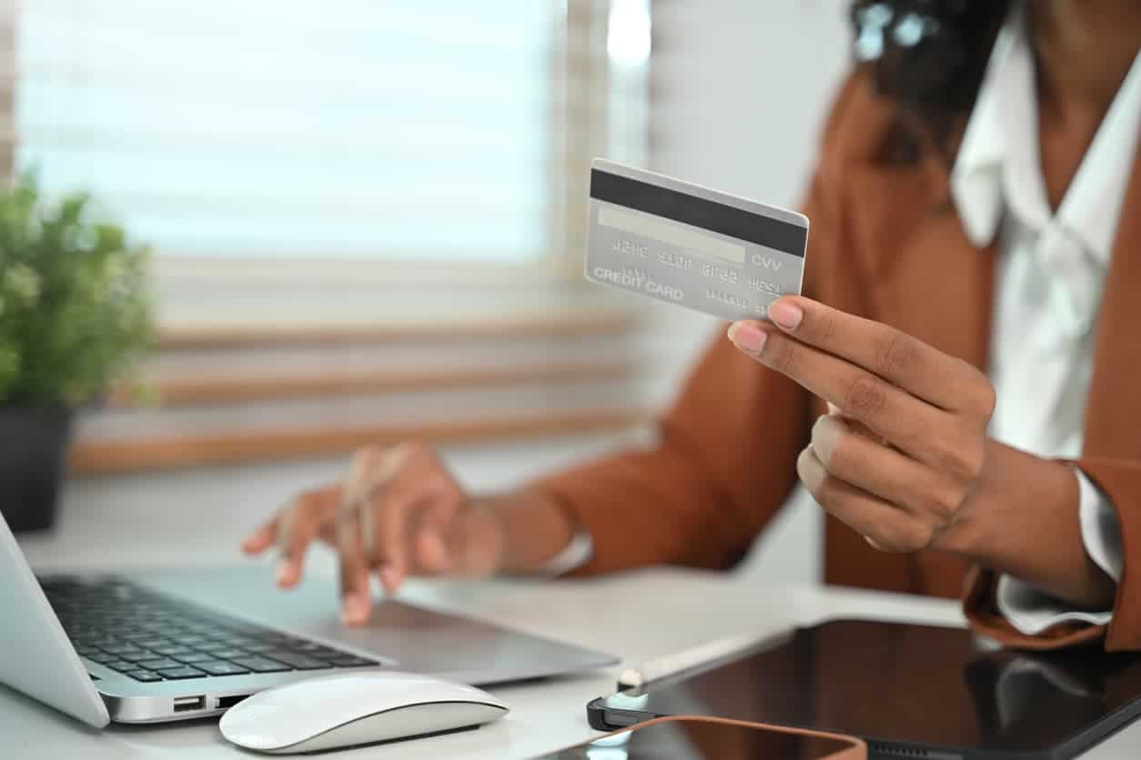 Woman holding a premium business credit card.