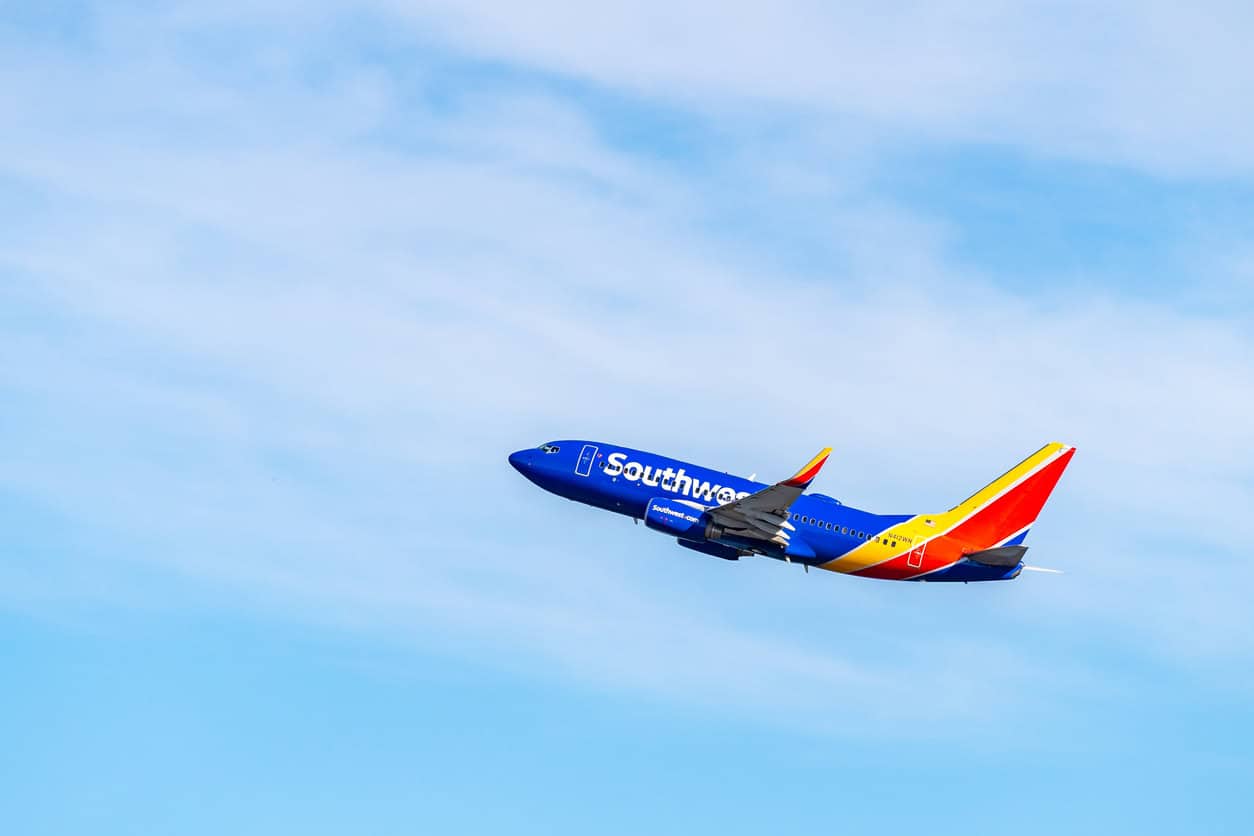 Southwest Airlines airplane flying in a clear blue sky