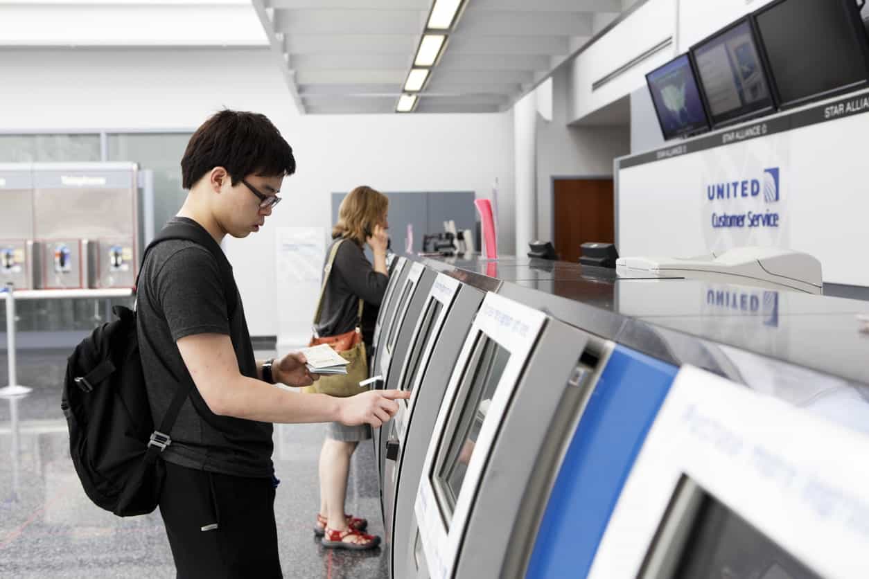 Traveler checking his booked flight with United Airlines.