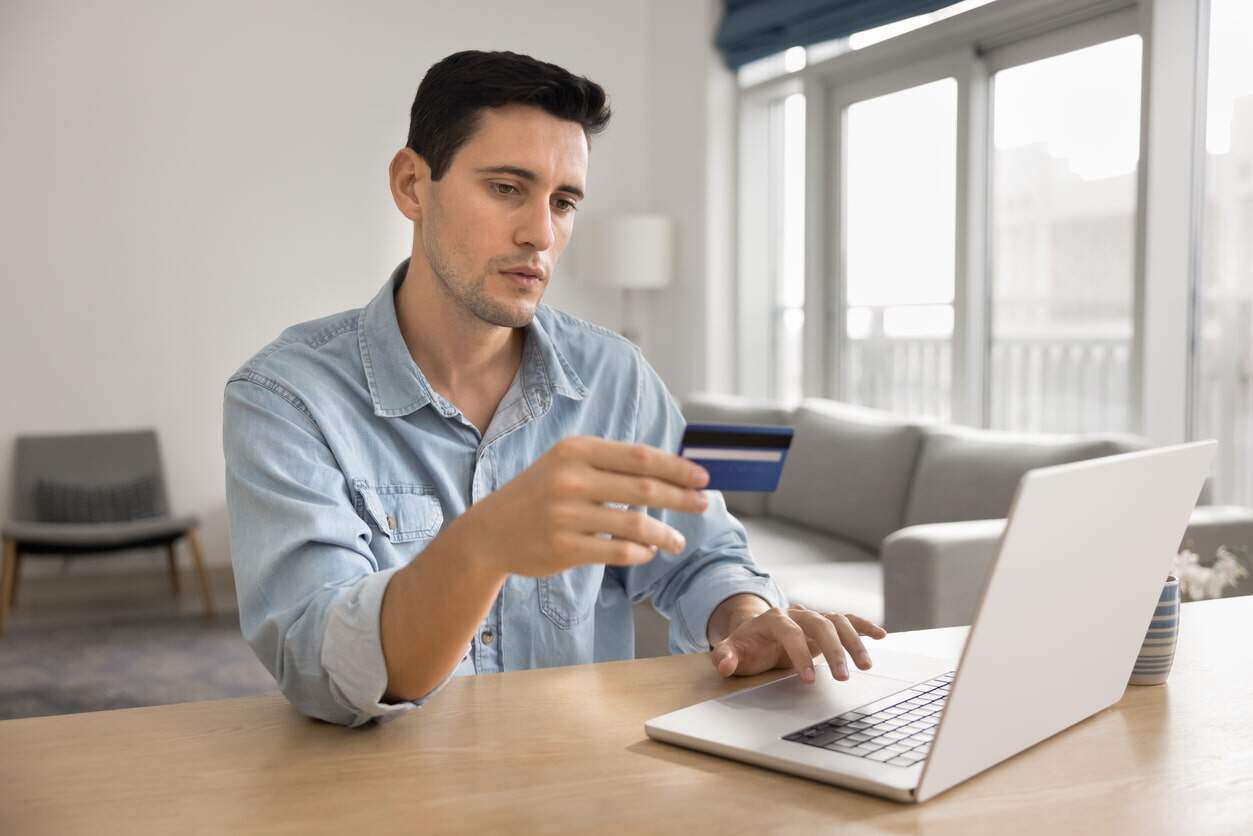 An existing cardholder checking new benefits of his credit card.
