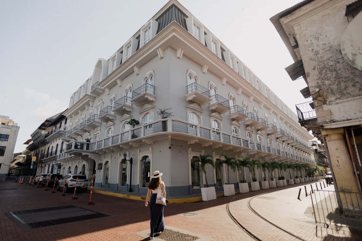 Woman walking along a colonial-style street in Casco Viejo, Panama City