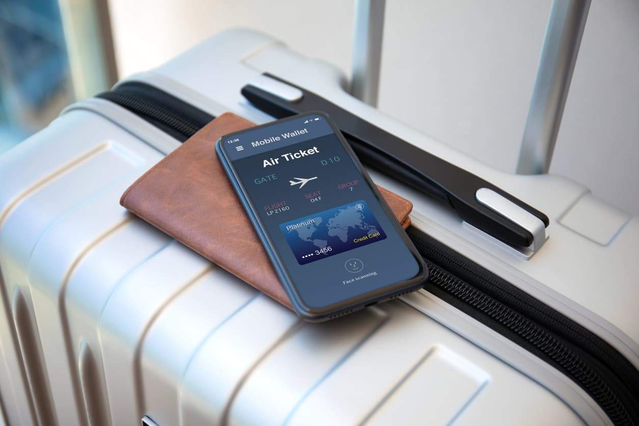 Smartphone with digital air ticket and credit card on luggage for booking Air Canada business class with points