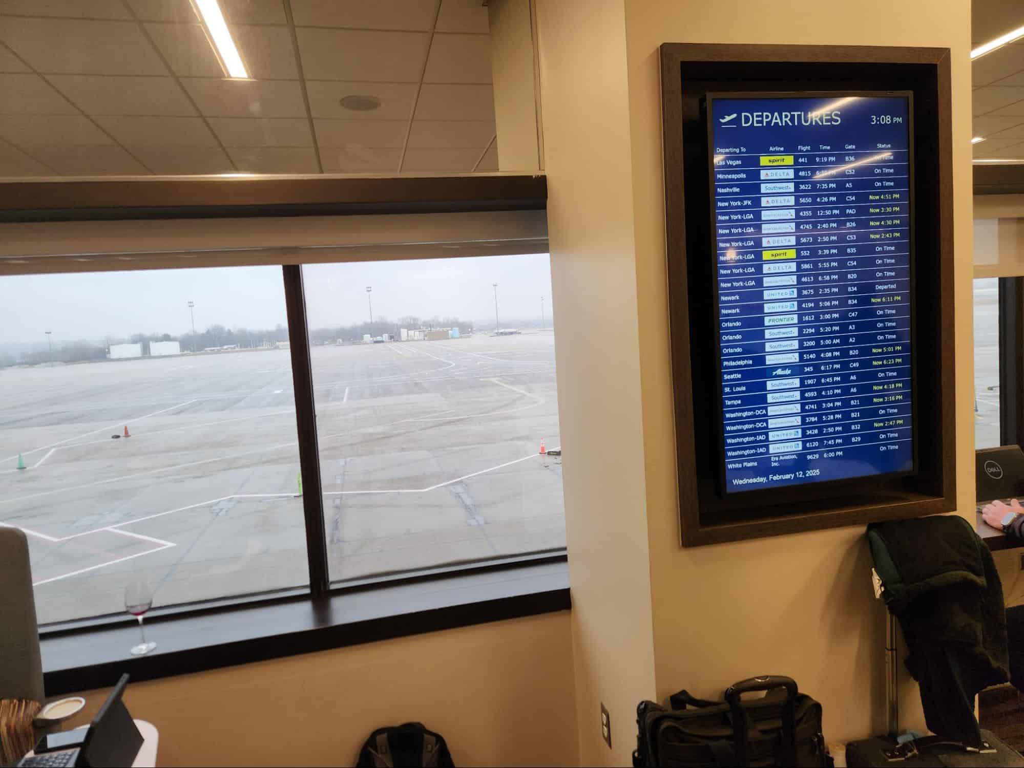 Escape Lounge CMH flight status screen