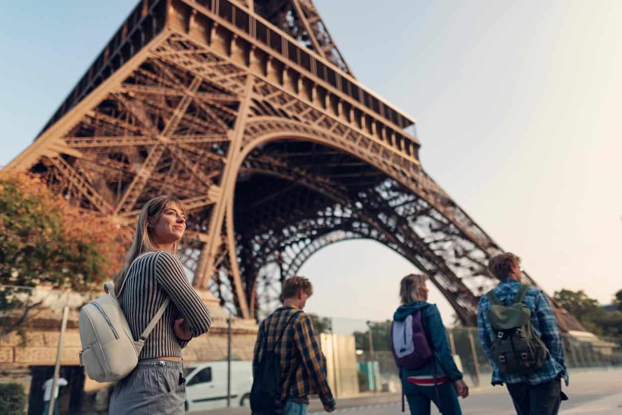 Tourists walking near the Eiffel Tower in Paris, France