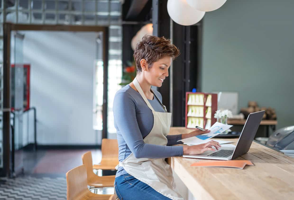entrepreneur reviewing expenses at desk