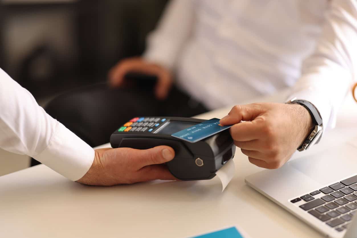 payment at a POS terminal illustrating business purchases