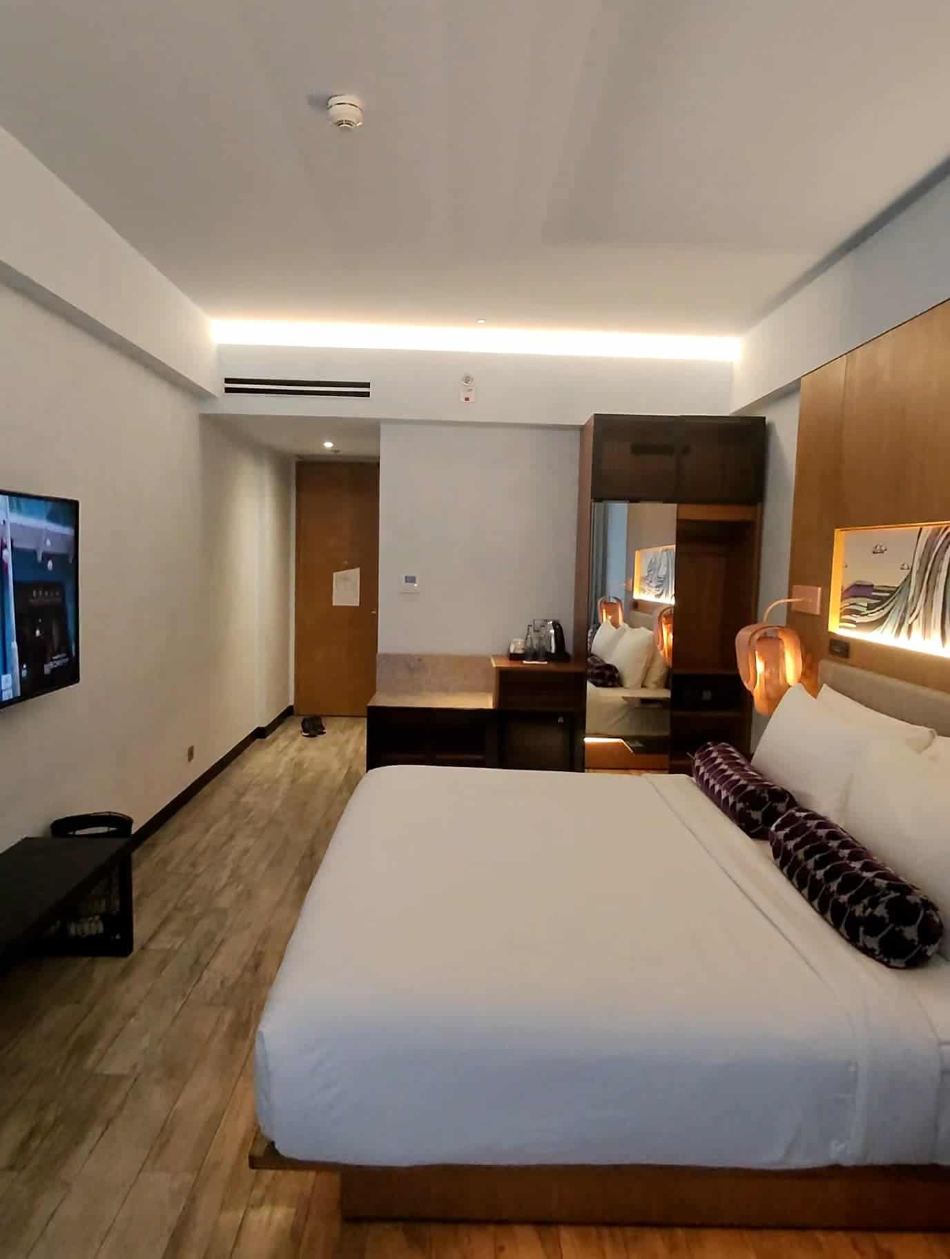 Stylish room at Aloft Bali Seminyak with minimalist decor and warm lighting