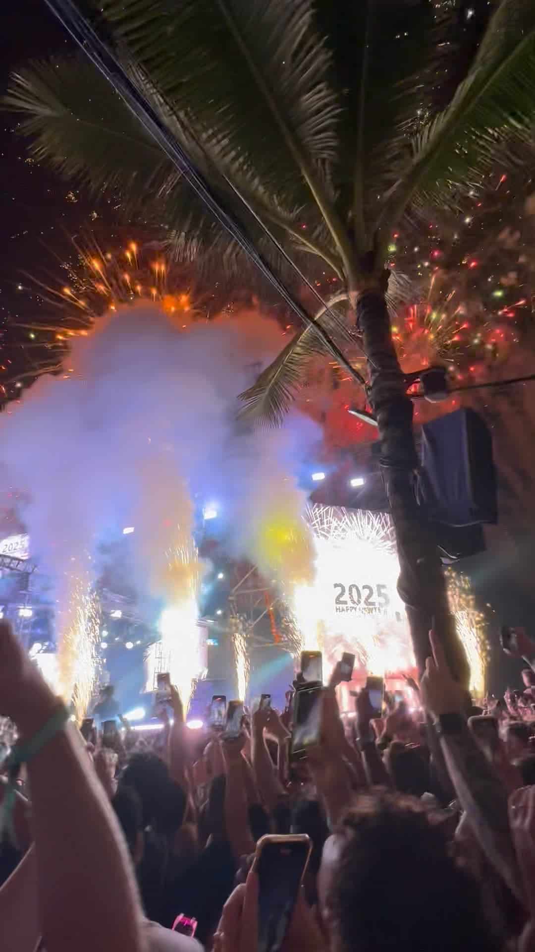 Fireworks and crowd celebration during New Year 2025 event in Bali