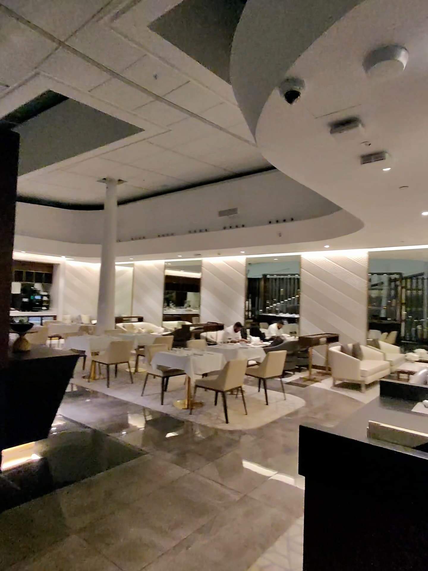 Etihad Airways First Class Lounge dining area with spacious seating and modern lighting