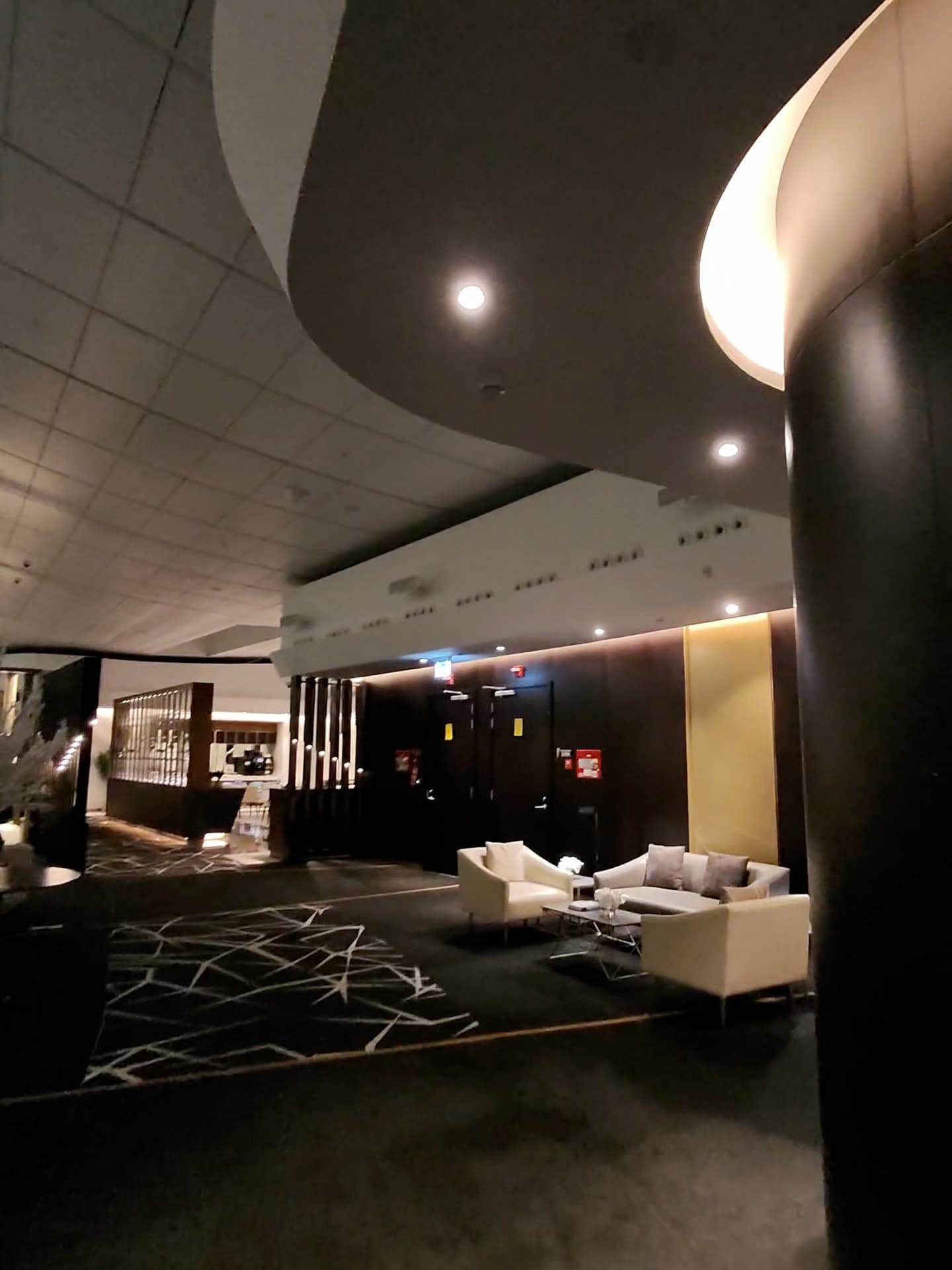 Elegant seating area inside Etihad Airways First Class Lounge with contemporary decor