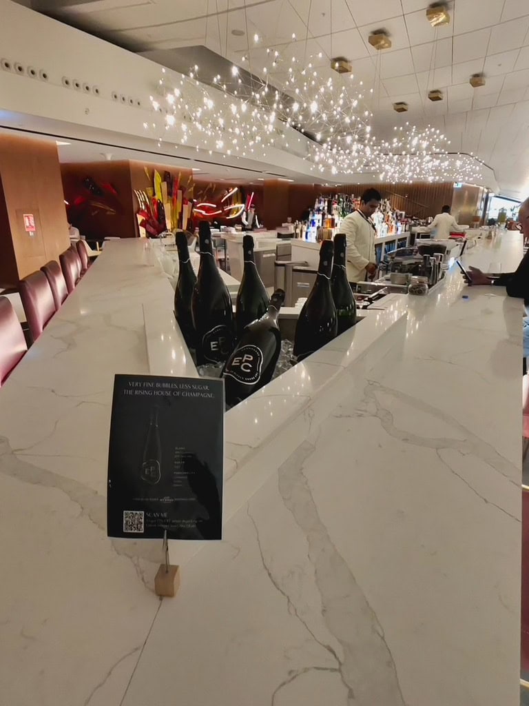 Etihad Airways Lounge bar with luxury champagne display and elegant lighting