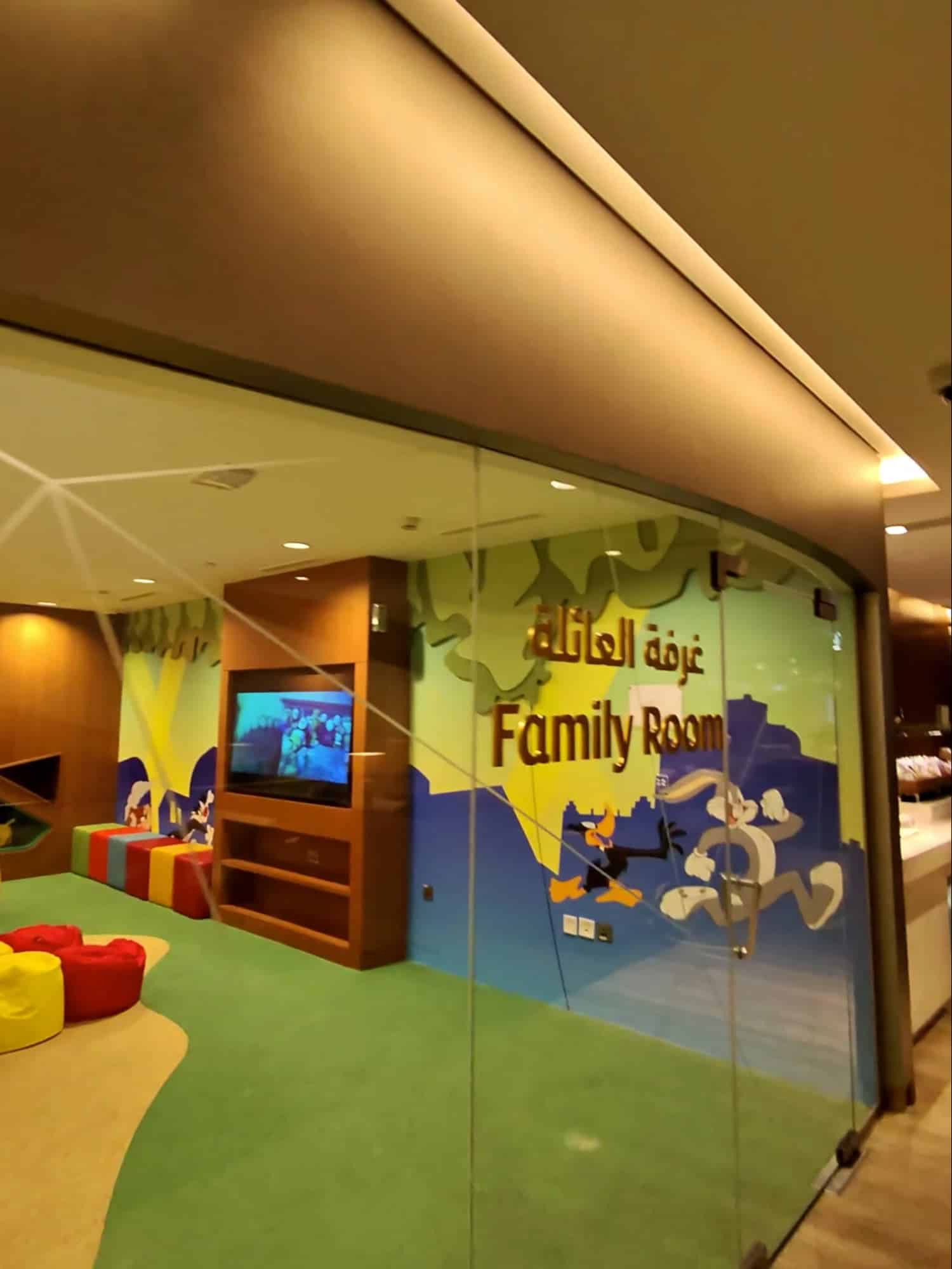 Colorful family room with kids’ play area inside Etihad Airways Lounge