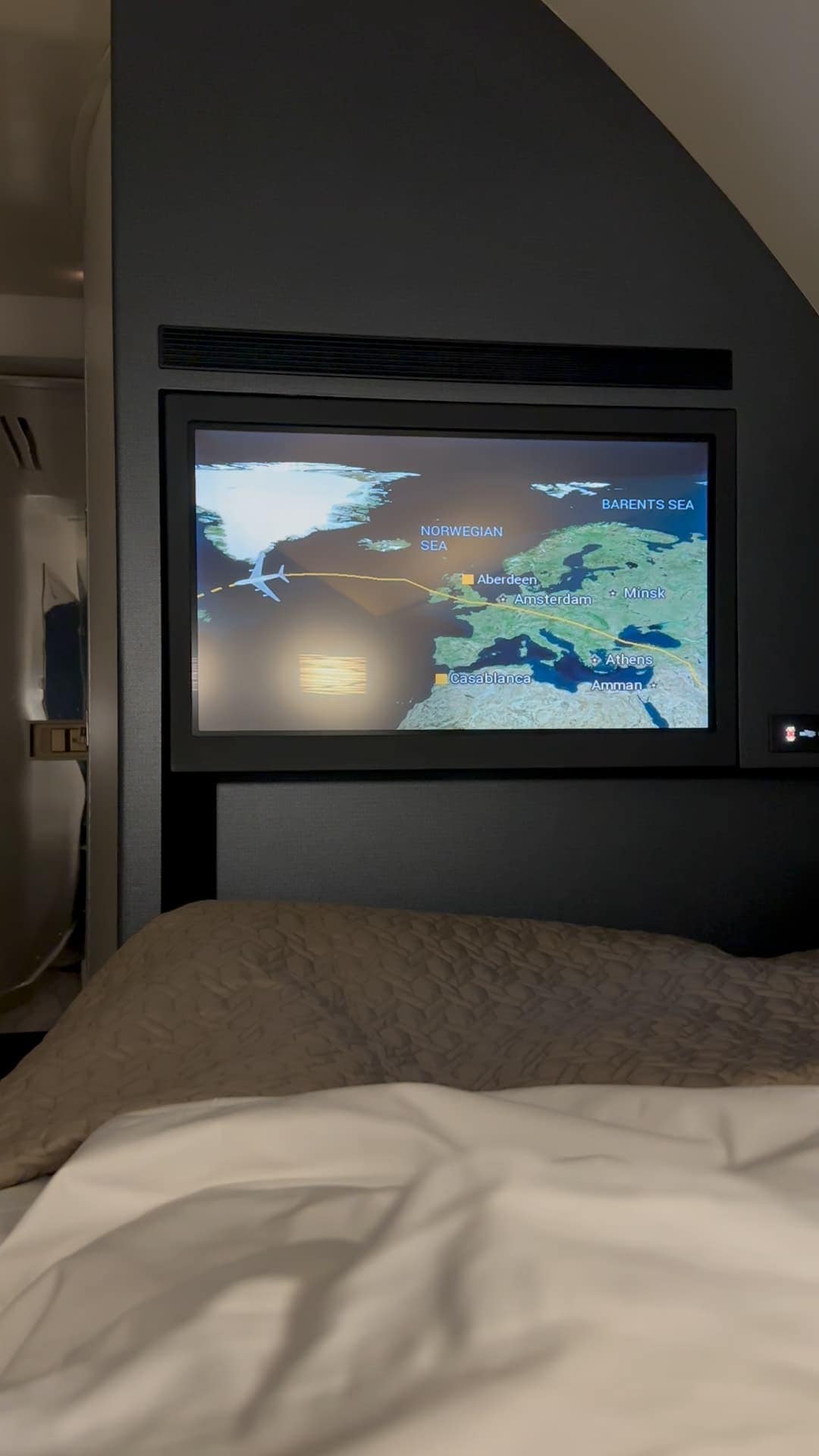 In-flight entertainment screen showing Etihad Airways flight map over Europe