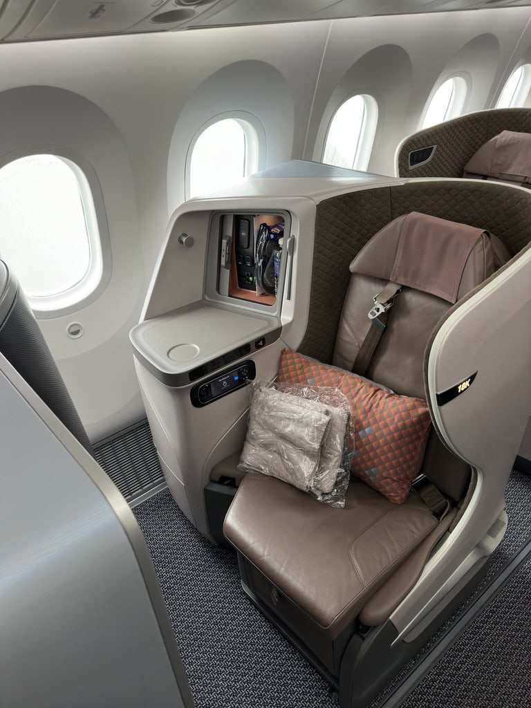 Singapore Airlines regional business class seat 10K setup with pillow and blanket