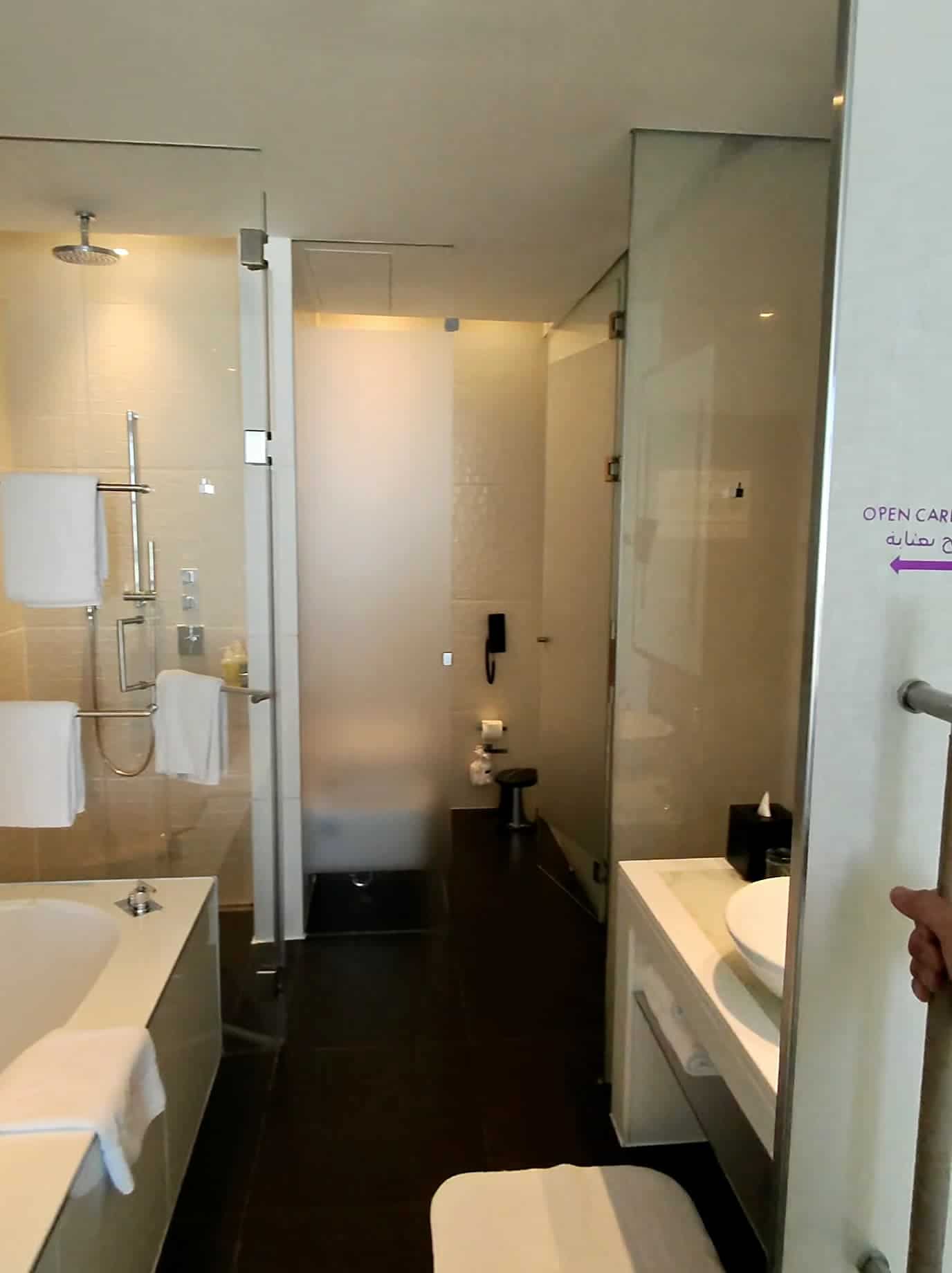 Elegant bathroom interior with glass shower and modern design at W Abu Dhabi