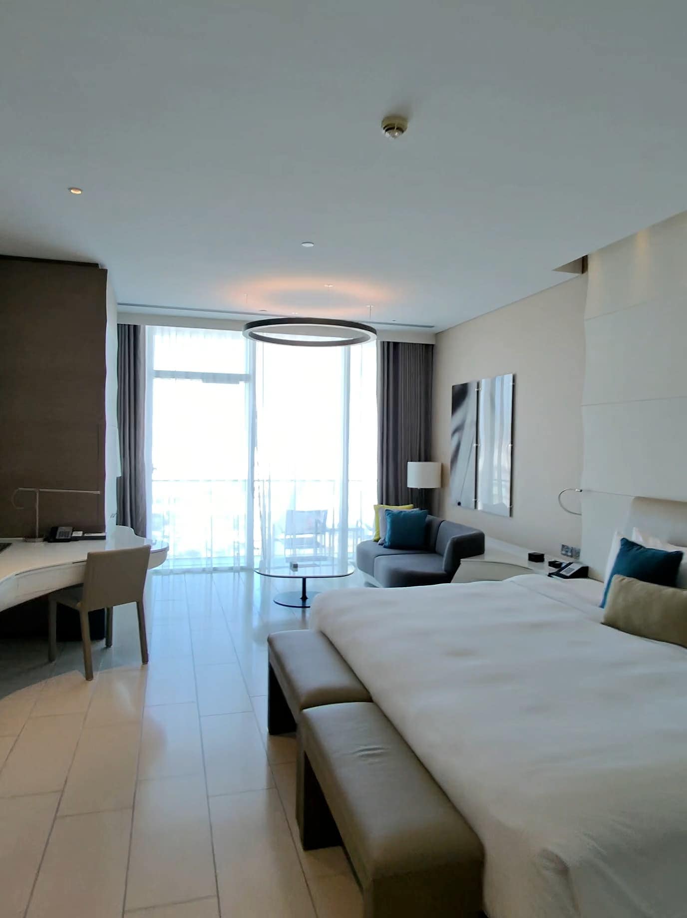 Spacious modern hotel room at W Abu Dhabi with balcony and contemporary decor
