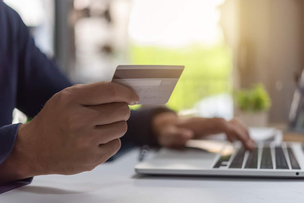 Holding a credit card while reviewing and comparing credit card options