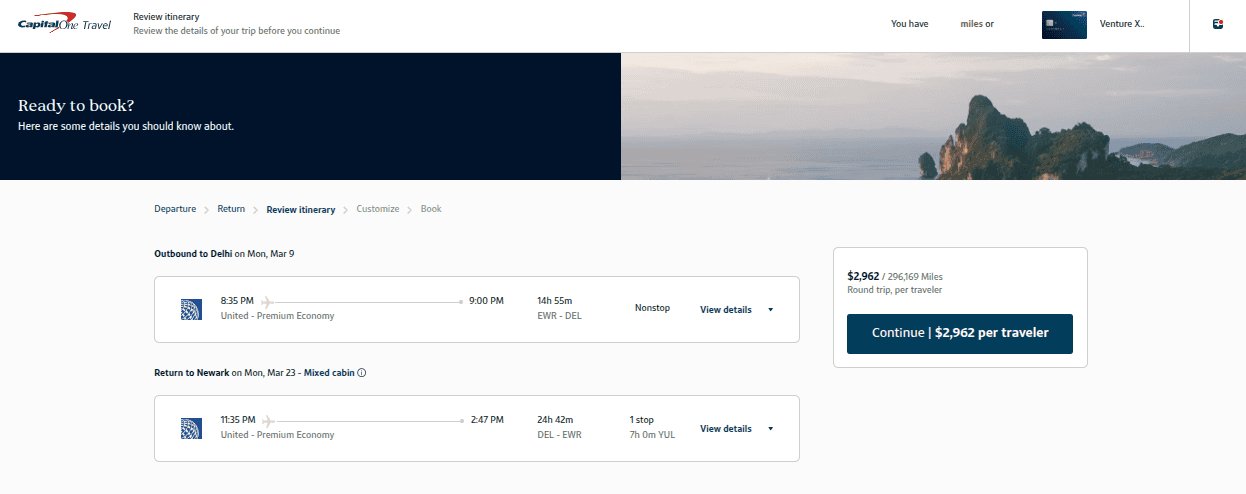 Capital One Travel booking showing a round-trip United Premium Plus itinerary between Newark (EWR) and Delhi (DEL) priced at 296,169 Capital One miles.