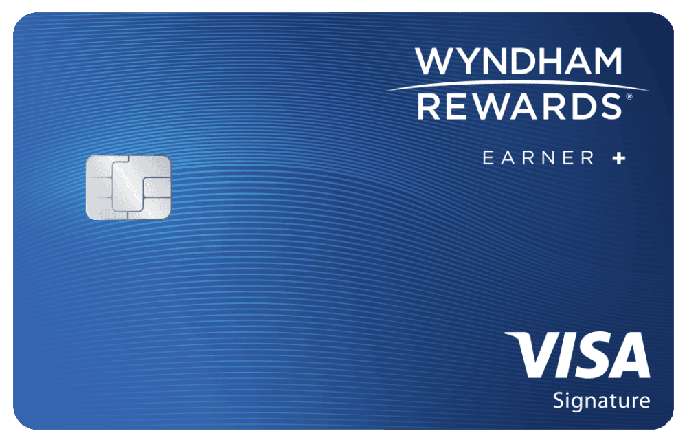 A blue Wyndham Rewards Earner Plus Card with a city skyline illustration, chip, and the words earner+, Wyndham Rewards, member name, and card number shown.
