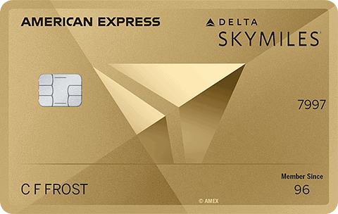 A gold American Express Delta SkyMiles credit card with a chip, contactless symbol, and the name C F Frost on the front. The card features geometric designs, displays Member Since 96, and is perfect for earning miles on travel.