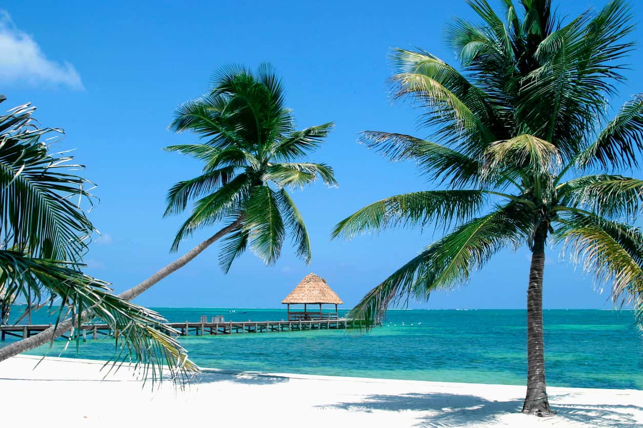 Tropical beach in Belize, a popular destination for travelers using points earned from business expenses.