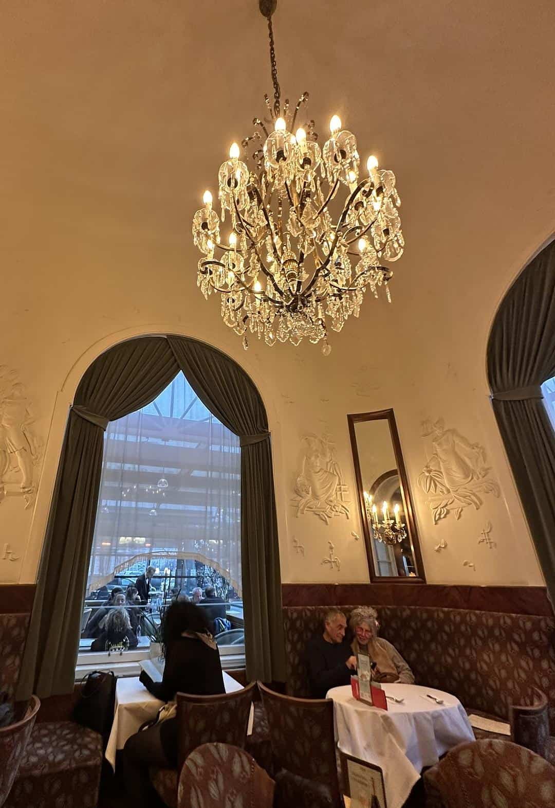 Elegant dining room inside Café Landtmann in Vienna.