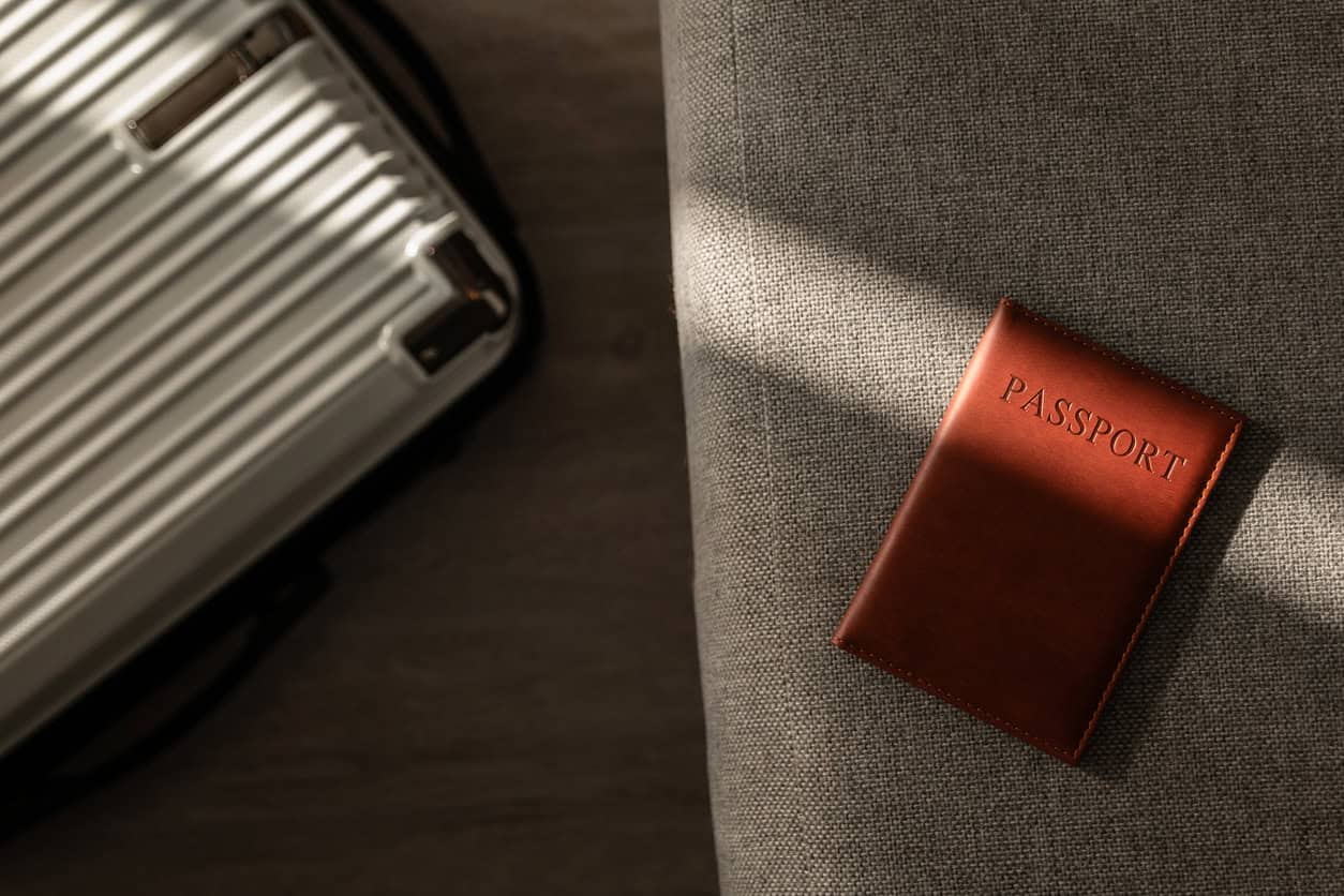 Passport and suitcase prepared for international travel.